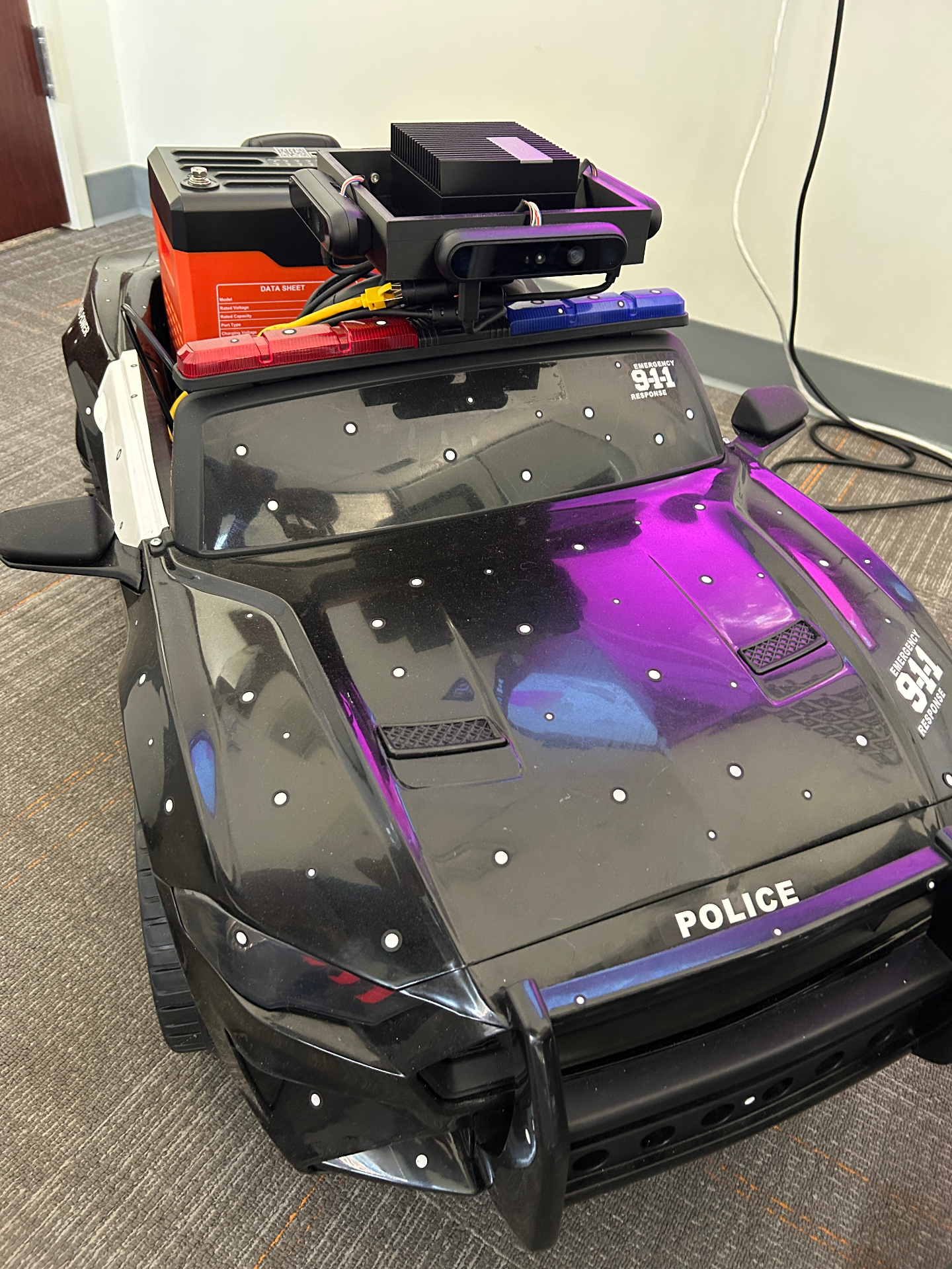 The deployed system with Jetson Orin compute module, Orbbec depth sensor, and power management installed on the roof rack